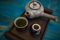 TRaditional Japanese teapot and cups with green tea Royalty Free Stock Photo