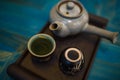 TRaditional Japanese teapot and cups with green tea Royalty Free Stock Photo