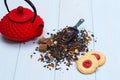 Traditional Japanese teapot, tea leaves and cookies Royalty Free Stock Photo