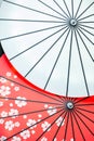 Traditional Japanese wagasa umbrellas displaying white and red cherry blossom patterns Royalty Free Stock Photo