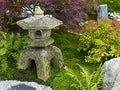 Traditional Japanese water garden with stone Lantern Royalty Free Stock Photo