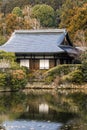 Traditional Japanese wooden architecture house surrounded by nature in autumn Royalty Free Stock Photo