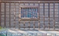 Traditional Japanese wooden house with reflection in a window to display  Autumn red orange green trees leaves Royalty Free Stock Photo