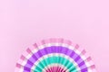 Traditional Japaneses festival paper fan with pink, turquoise, white stripes Birthday party, celebration holidays concept Abstract