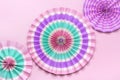 Traditional Japaneses festival paper fan with pink, turquoise, white stripes Birthday party, celebration holidays concept Abstract