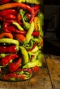 Traditional Jarred yellow, green, red, hot peppers. Royalty Free Stock Photo