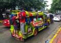 Traditional Jeepney overloaded with passengers