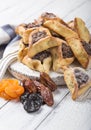 Traditional Jewish Hamantaschen cookies with dried apricots, dates. Purim celebration concept. ÃÂ¡arnival holiday background.