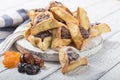 Traditional Jewish Hamantaschen cookies with dried apricots, dates. Purim celebration concept. ÃÂ¡arnival holiday background.