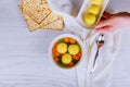 Hot Homemade Matzo Ball Soup in a Bowl Passover wine and matzah