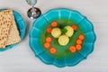 Matzah balls in a pot of soup during the Jewish holiday of Passover - Pesach. Royalty Free Stock Photo