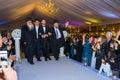 Rehovot, Israel - 11.01.2019. Rabbi leading Jewish groom to Chuppah in Jewish chasid wedding with happy guests