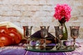 Traditional Jewish Sabbath Shalom ritual fresh challah bread on kiddush four cup of red kosher wine