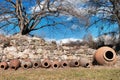 traditional jug for wine making near the ancient stone wall