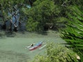 Traditional Jukung fishing boat in a mangrove at Bunaken Island, North-Sulawesi, Indonesia Royalty Free Stock Photo