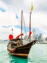 Traditional junk sailboat with red sails in the Victoria harbor, Hong Kong Royalty Free Stock Photo