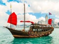 Traditional junk sailboat with red sails in the Victoria harbor, Hong Kong Royalty Free Stock Photo