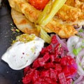 Traditional kebab meat plate with tzatziki sauce, pepperoni, beetroot and pita bread Royalty Free Stock Photo