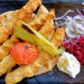 Traditional kebab meat plate with tzatziki sauce, tomato, pepperoni, onion, beetroot and pita bread. Royalty Free Stock Photo