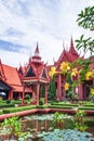 Traditional Khmer architecture and beautiful courtyard of the National Museum of Cambodia, lush pond with lotus, colorful flowers Royalty Free Stock Photo