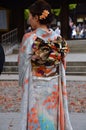 An orange traditional kimono dress.