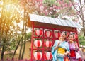 Traditional kimono girls eat fried meatballs Royalty Free Stock Photo