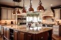 traditional kitchen with granite countertops, stainless steel appliances, and copper lighting fixtures Royalty Free Stock Photo