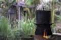 Traditional Kitchen, Sticky Rice Steaming Pot - The local kitchen in the village.Black pot boiling for the rice cooker on the fire Royalty Free Stock Photo