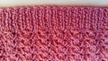 Traditional knitted pattern with crochets of thread forming beautiful, even holes. The gum is knitted according to the pattern: Royalty Free Stock Photo