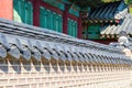 Traditional Korean brick wall and black ceramic roof with Traditional Korean building, Seoul, South Korea Royalty Free Stock Photo