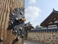 Traditional Korean Hanok Village building with old wooden door and metal lock in the afternoon in Seoul, South Korea Royalty Free Stock Photo