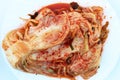 Traditional korean kimchi cabbage on a white plate close-up top view