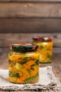 Traditional Korean snack of kimchi cucumbers in two glass jars: cucumbers marinated with carrots, hot pepper and garlic. Royalty Free Stock Photo