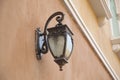 Traditional lamp post on the wall of a building Royalty Free Stock Photo