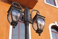 Traditional lamp post on the wall of a building Royalty Free Stock Photo