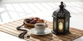 Traditional lantern, dates, coffee, and rosary on straw mat Royalty Free Stock Photo