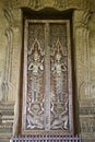 Traditional Lao style Buddhist church door Royalty Free Stock Photo