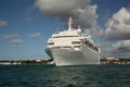 Traditional large white cruise ship sailing from Antigua on a beautiful blue sky tropical day, Caribbean Royalty Free Stock Photo