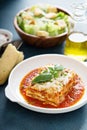 Traditional lasagna on white plate