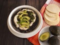 Traditional Latinamerica Black Beans Soup with Avocado and Cream including Homemade Flat Tortilla