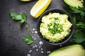 Traditional latinamerican mexican sauce guacamole on black. Royalty Free Stock Photo