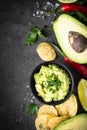 Traditional latinamerican mexican sauce guacamole on black. Royalty Free Stock Photo