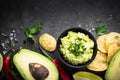 Traditional latinamerican mexican sauce guacamole on black. Royalty Free Stock Photo