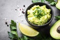 Traditional latinamerican mexican sauce guacamole on black. Royalty Free Stock Photo