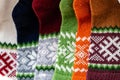 Traditional Latvian knitted woolen mittens and socks, precious artefacts, variety of colors, different in Latvian regions Royalty Free Stock Photo