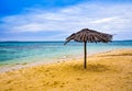 Traditional lazy hut yellow sandy beach in the clear blue morning sky