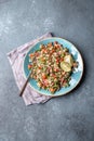 Traditional Lebanese salad tabouli tabule with quinoa, herbs, tomatoes, mint and lemon