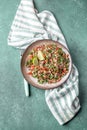 Traditional Lebanese salad tabouli tabule with quinoa, herbs, tomatoes, mint and lemon