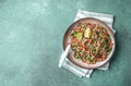 Traditional Lebanese salad tabouli tabule with quinoa, herbs, tomatoes, mint and lemon