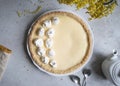 Traditional lemon tart with curd filling decorated with meringues